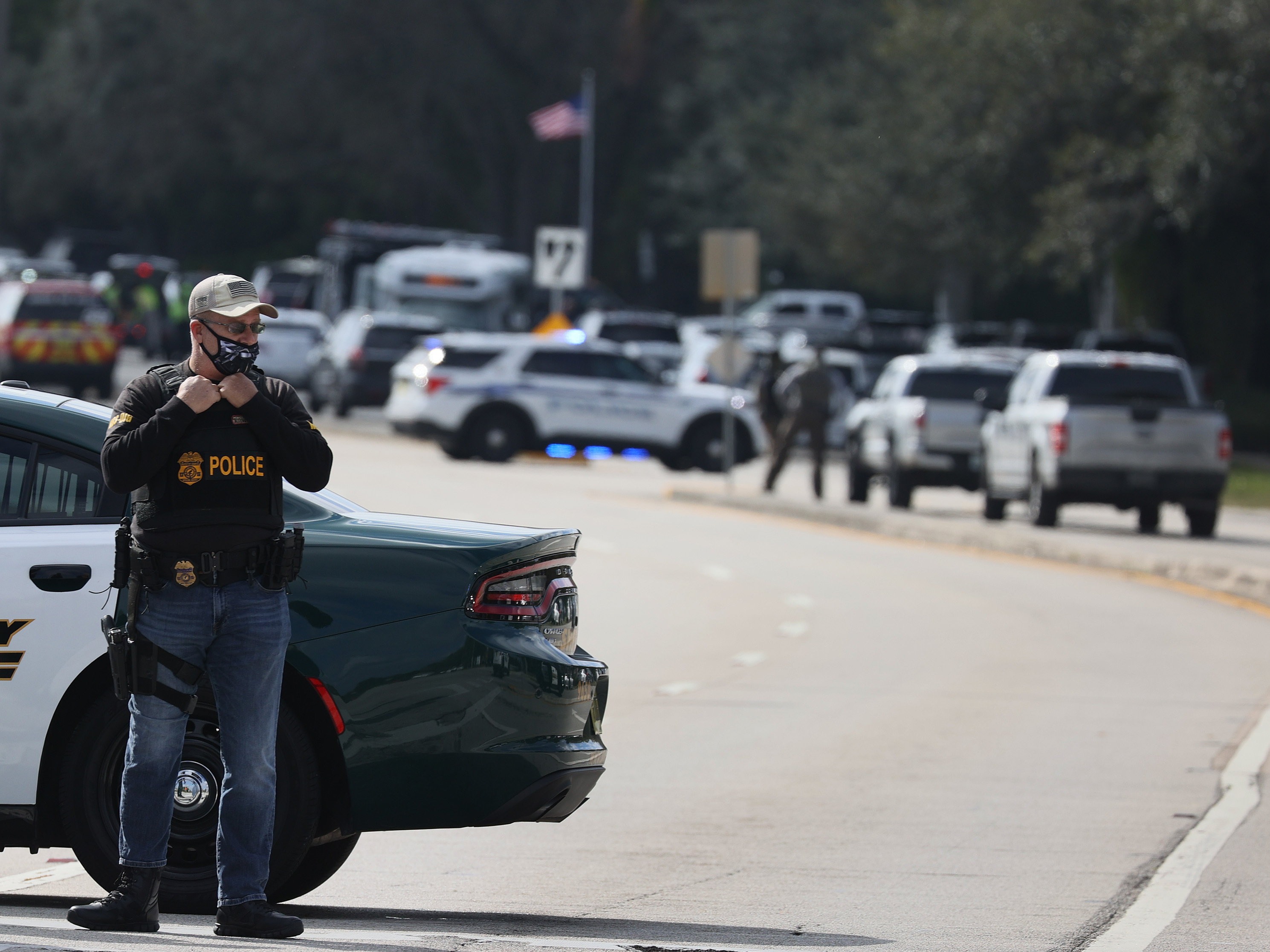 caption: Law enforcement officers block off an area near an apartment complex in Sunrise, Fla., where several FBI agents were shot on Tuesday as they served a warrant in a violent crimes against children case.