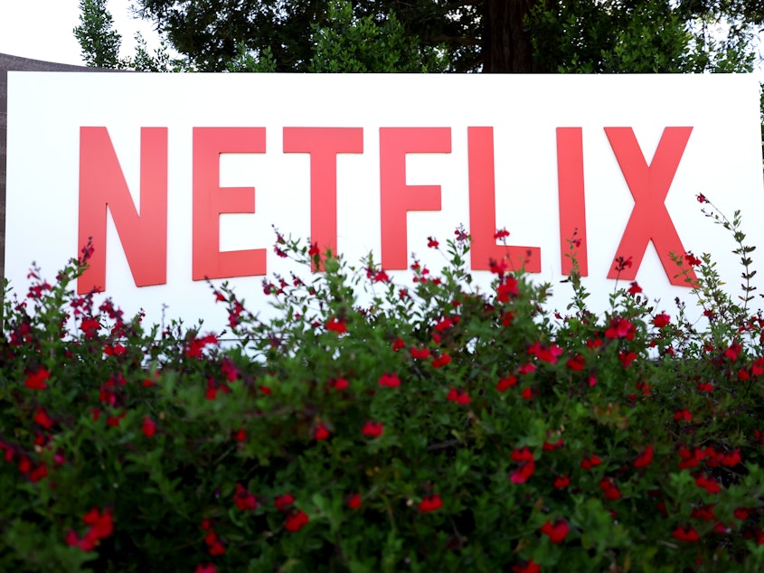 caption: Netflix is laying off 150 employees to rein in costs amid slowing revenue growth disclosed during the streaming giant's first-quarter earnings call.