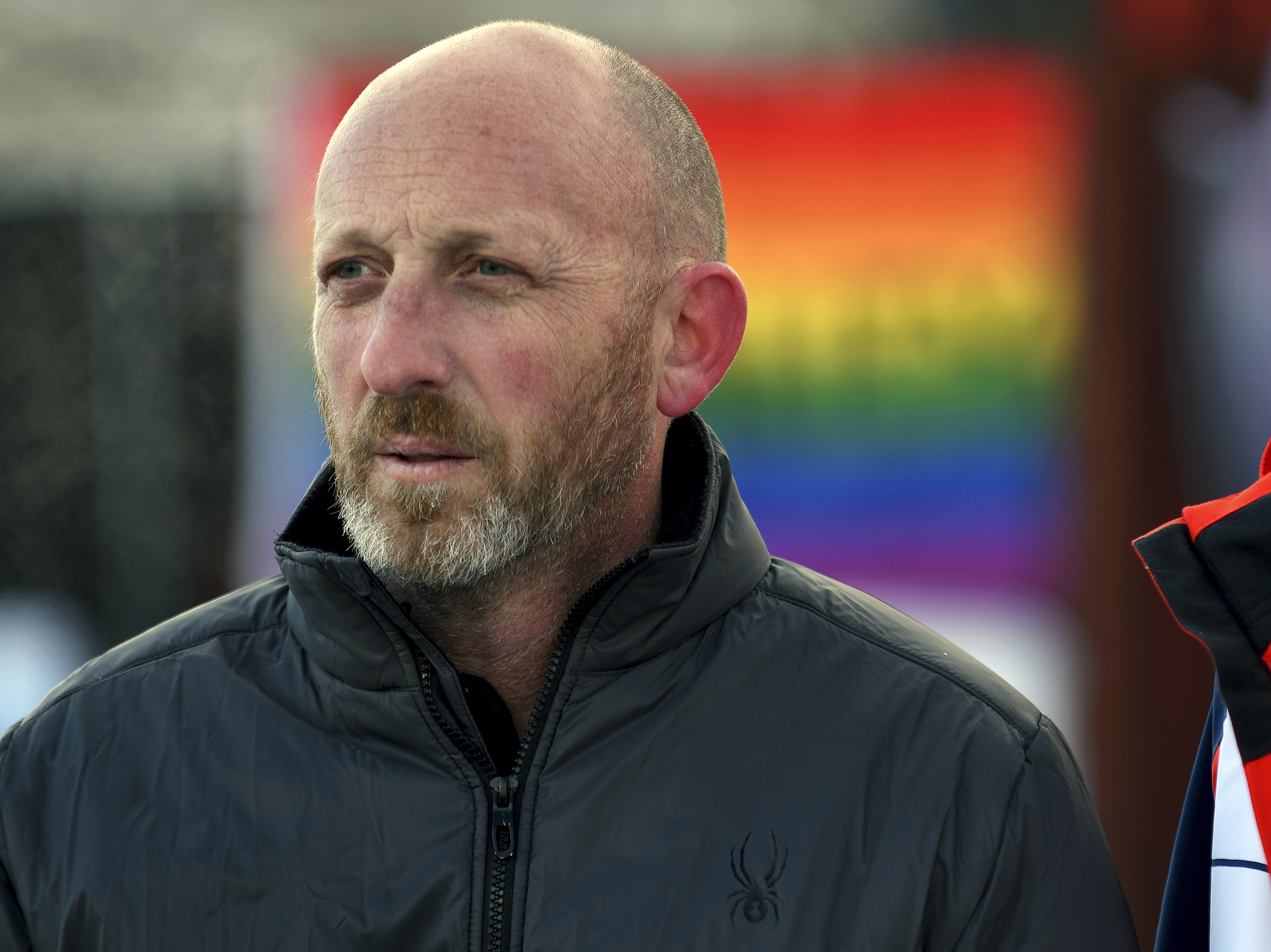 caption: Nic Grzecka, owner of Club Q, stands outside the business after a news conference in Colorado Springs, Colo., on Tuesday, Nov. 29, 2022.