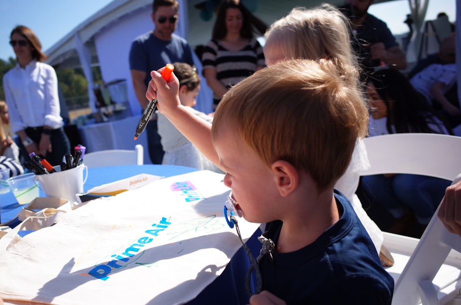 caption: Children, including some undergoing treatment for cancer, gathered for Amazon.com's announcement of donations for cancer research.