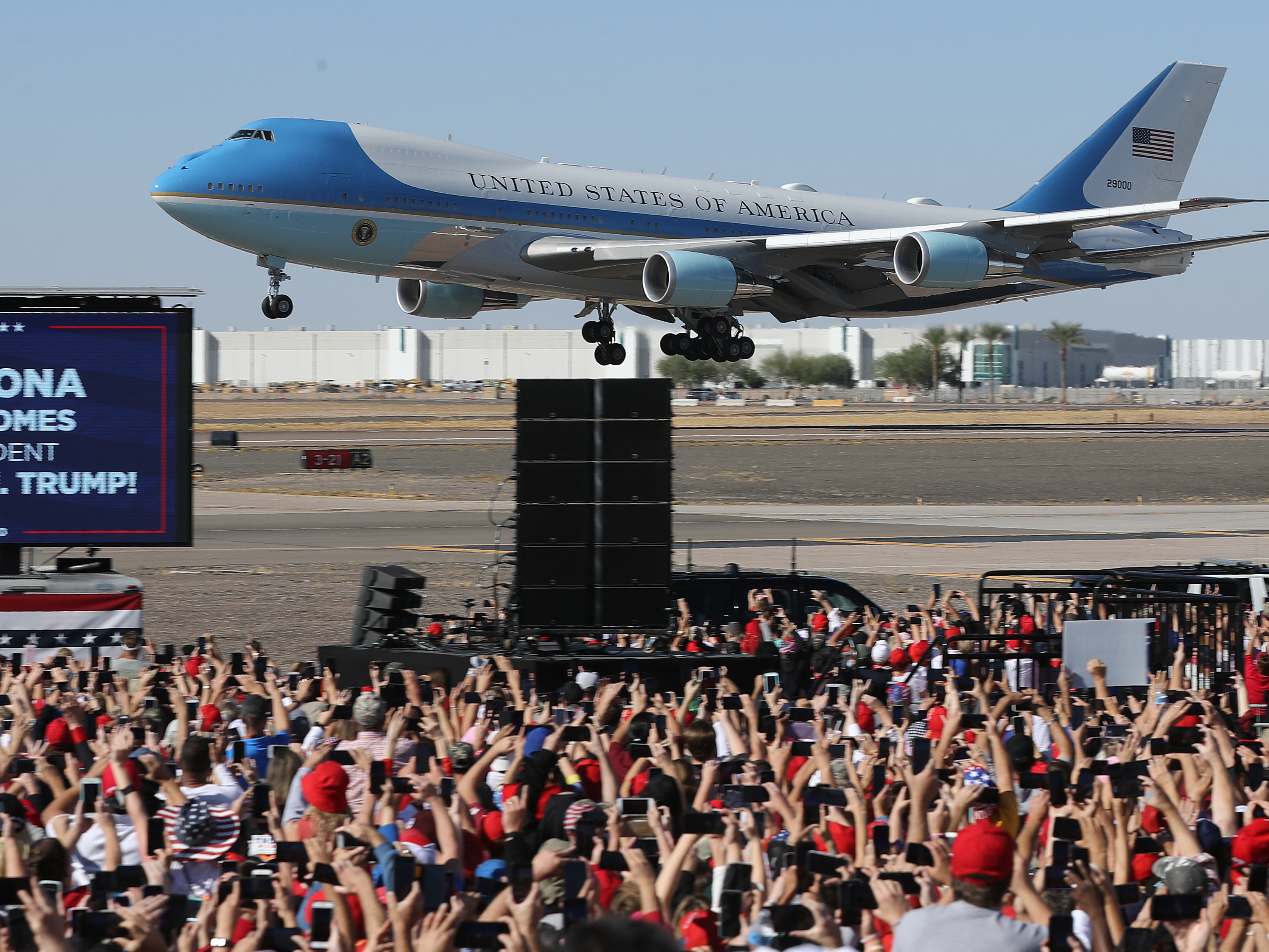caption: Air Force One lands at Phoenix Goodyear Airport for a campaign rally less than a week before Election Day.