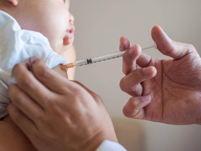 caption: Doctors are urging parents to keep all their child's vaccinations up to date — now, more than ever.