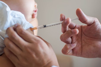 caption: Doctors are urging parents to keep all their child's vaccinations up to date — now, more than ever.