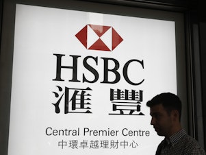 caption: HSBC says it will shed about 35,000 jobs over the next three years. The firm wants to shift more focus to Asian markets.