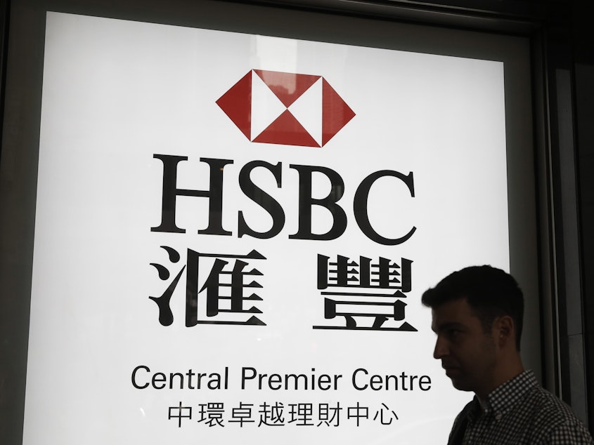 caption: HSBC says it will shed about 35,000 jobs over the next three years. The firm wants to shift more focus to Asian markets.
