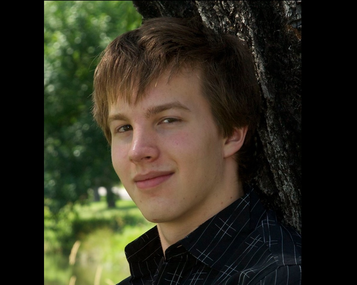 caption: Daniel DeHollander's senior photo. He committed suicide in 2014 at age 18. 