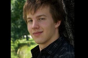 caption: Daniel DeHollander's senior photo. He committed suicide in 2014 at age 18. 