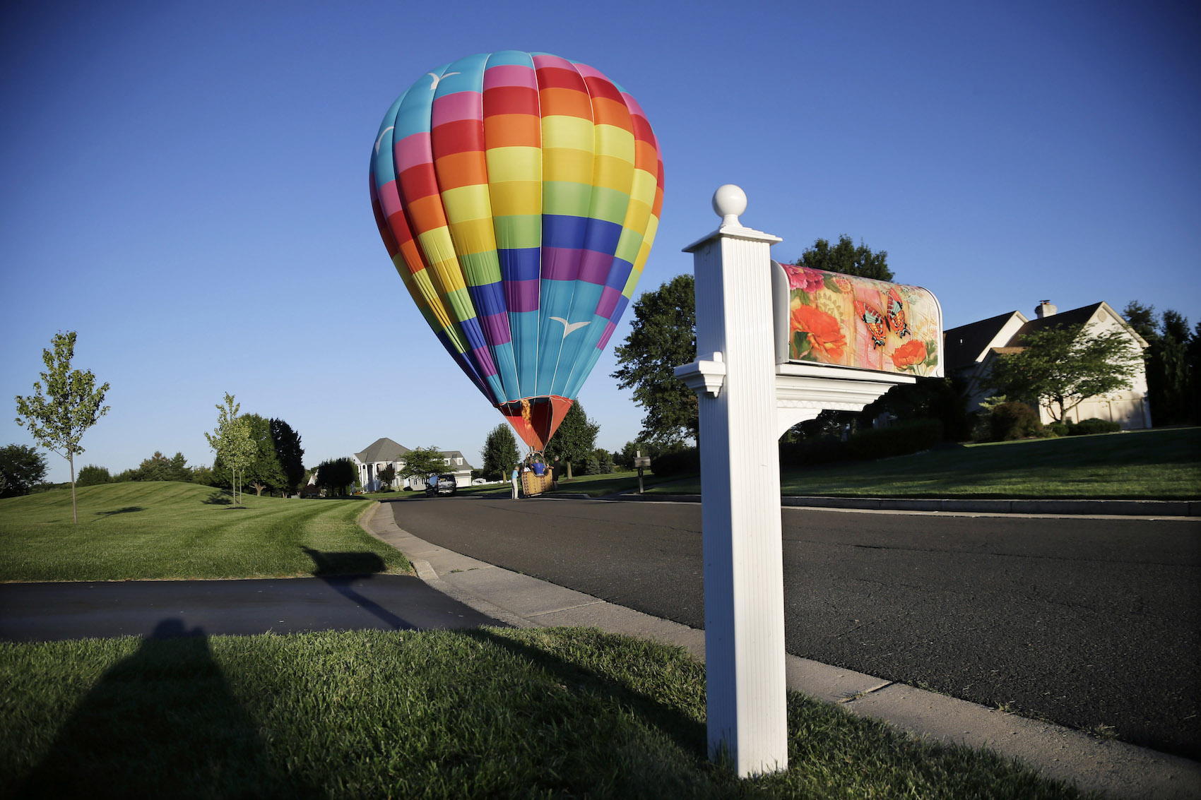 caption: A large hot air balloon lands in the road near Newtown, Pa., Friday, Sept. 6, 2013. (Mel Evans/AP)