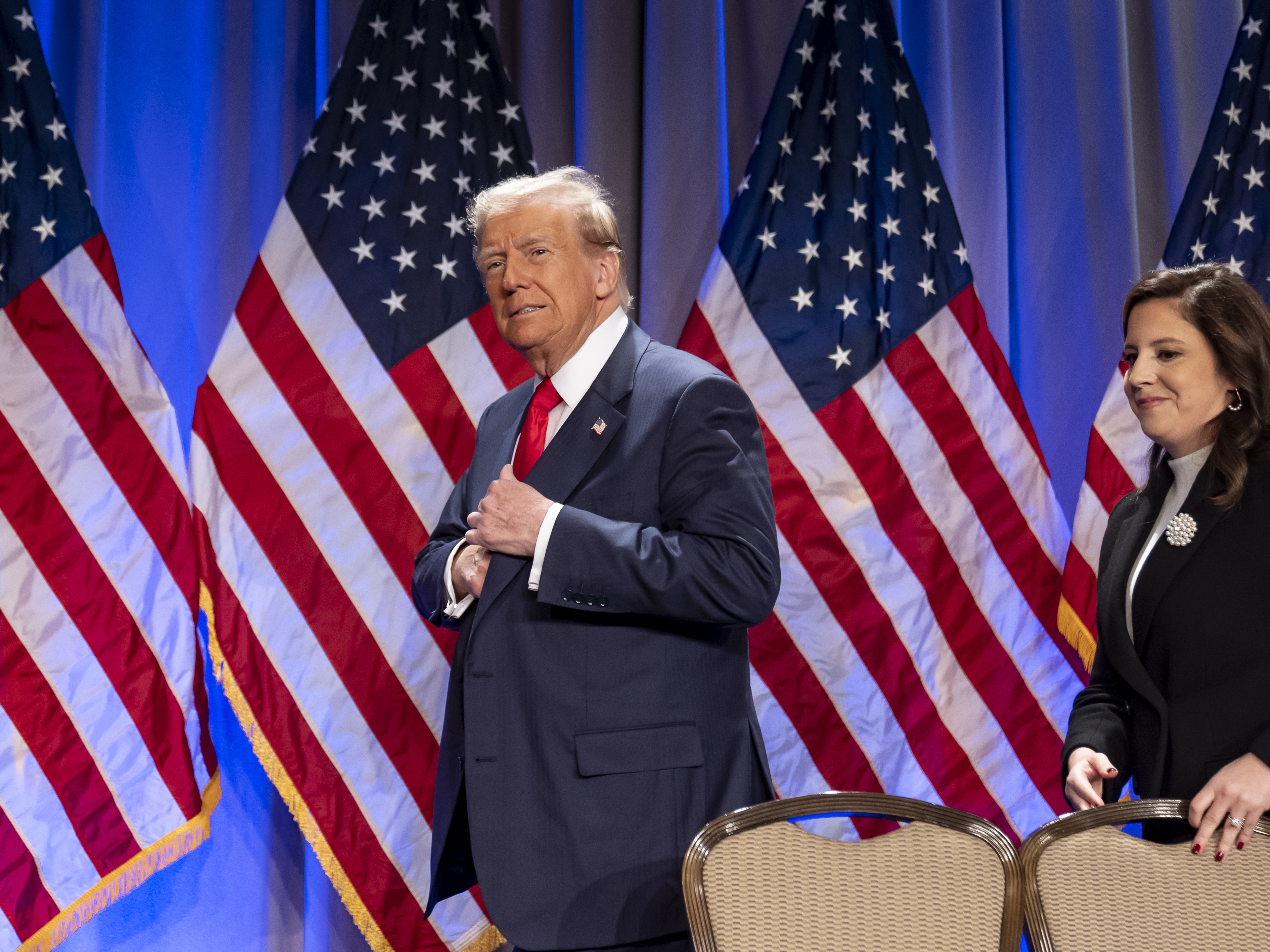 caption: President-elect Donald Trump arrives to speak at a meeting of the House GOP conference, followed by Rep. Elise Stefanik, R-N.Y., Wednesday, Nov. 13, 2024, in Washington.