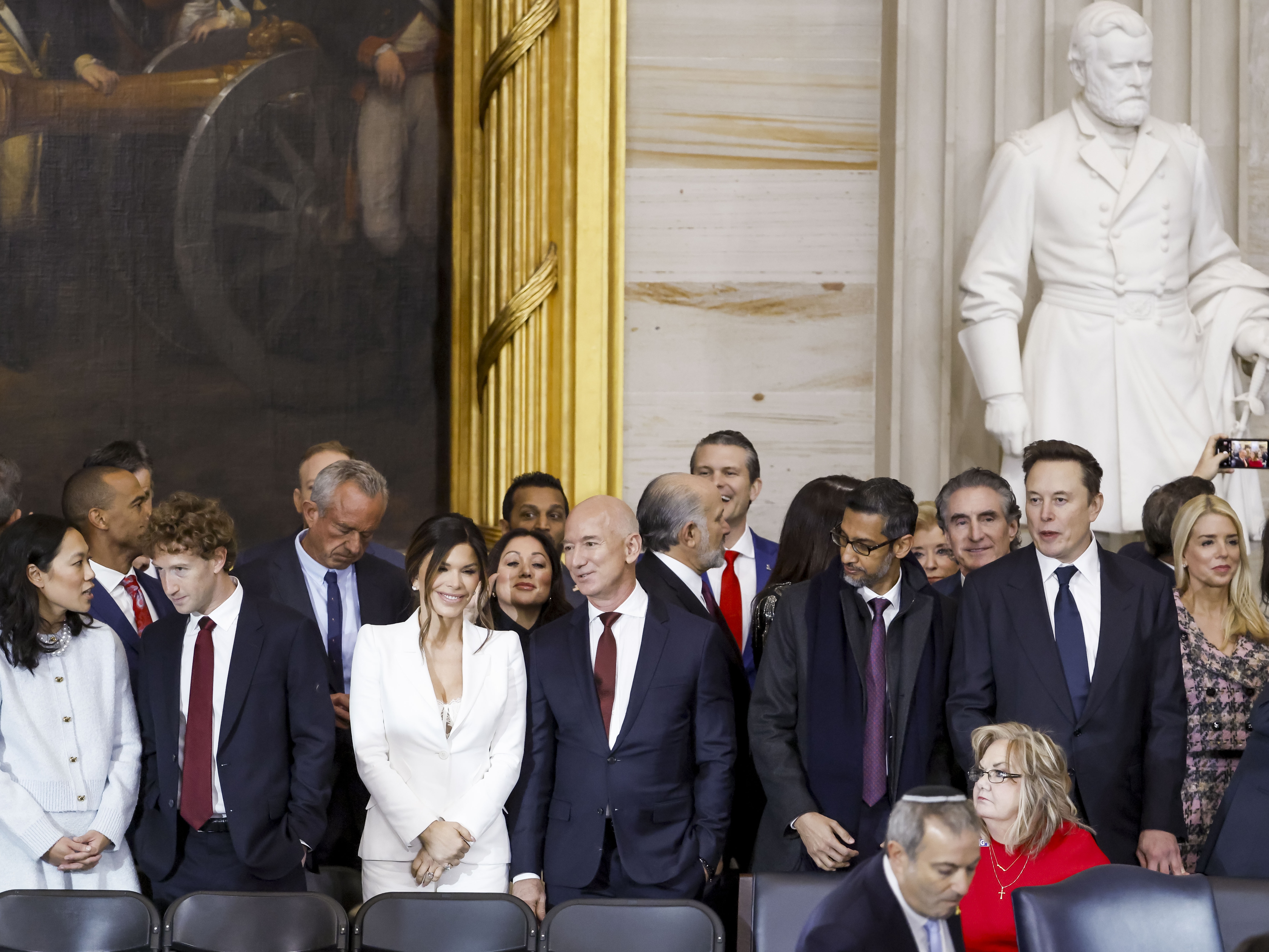 caption: Priscilla Chan, Meta CEO Mark Zuckerberg, Lauren Sanchez, businessman Jeff Bezos , Alphabet's CEO Sundar Pichai and businessman Elon Musk, among other dignitaries, attend the United States Capitol on Jan. 20.