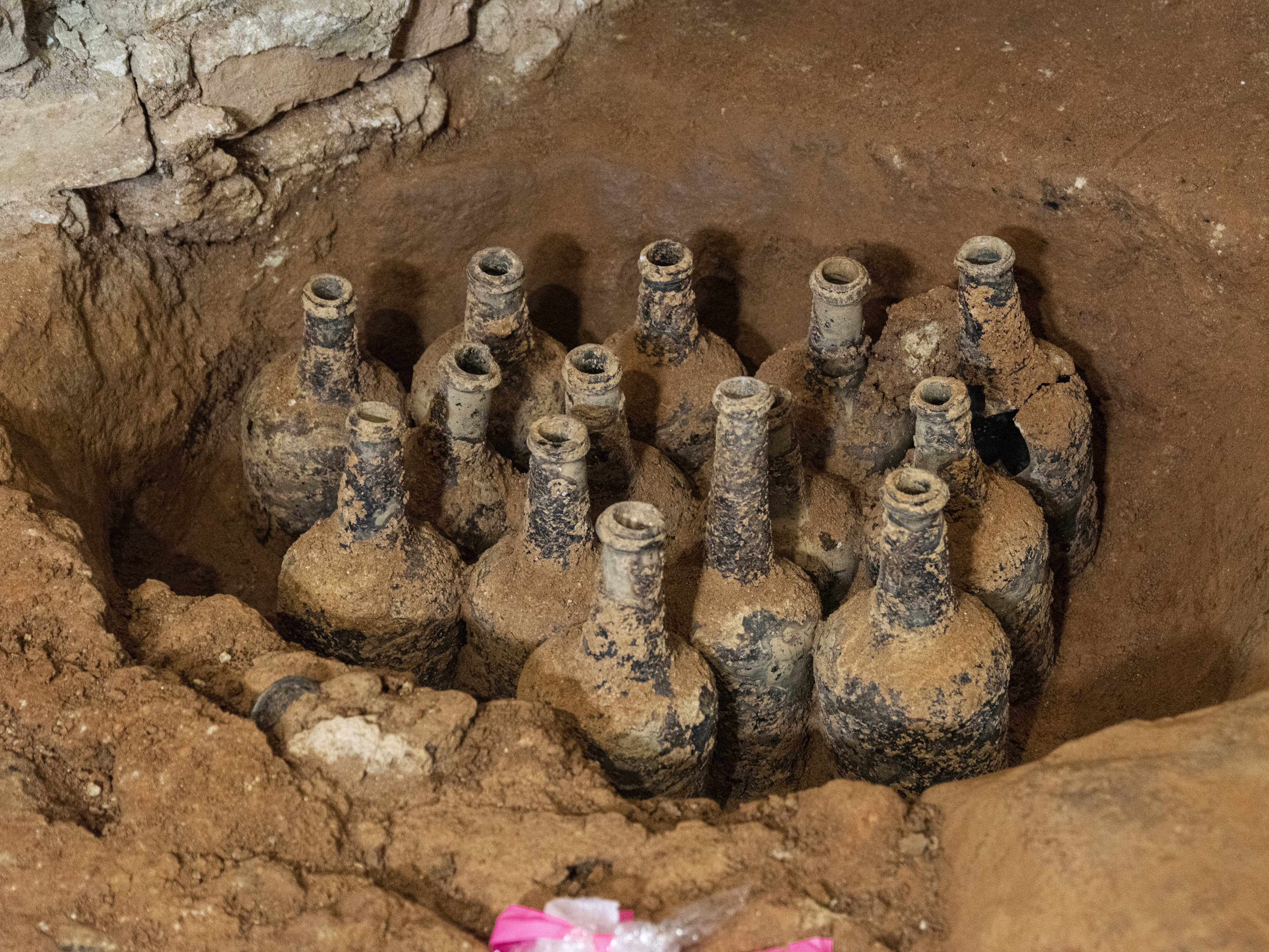 caption:  Archaeologists on a multi-year restoration project found 35 bottles of cherries and berries in five different pits in the Mount Vernon cellar.