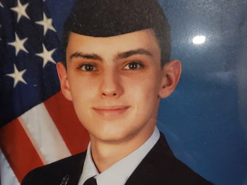caption: Jack Teixeira (in an undated undated photo posted on Facebook by his mother on Veterans Day in 2021) faces two criminal charges after posting classified Pentagon documents on social media.