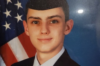 caption: Jack Teixeira (in an undated undated photo posted on Facebook by his mother on Veterans Day in 2021) faces two criminal charges after posting classified Pentagon documents on social media.
