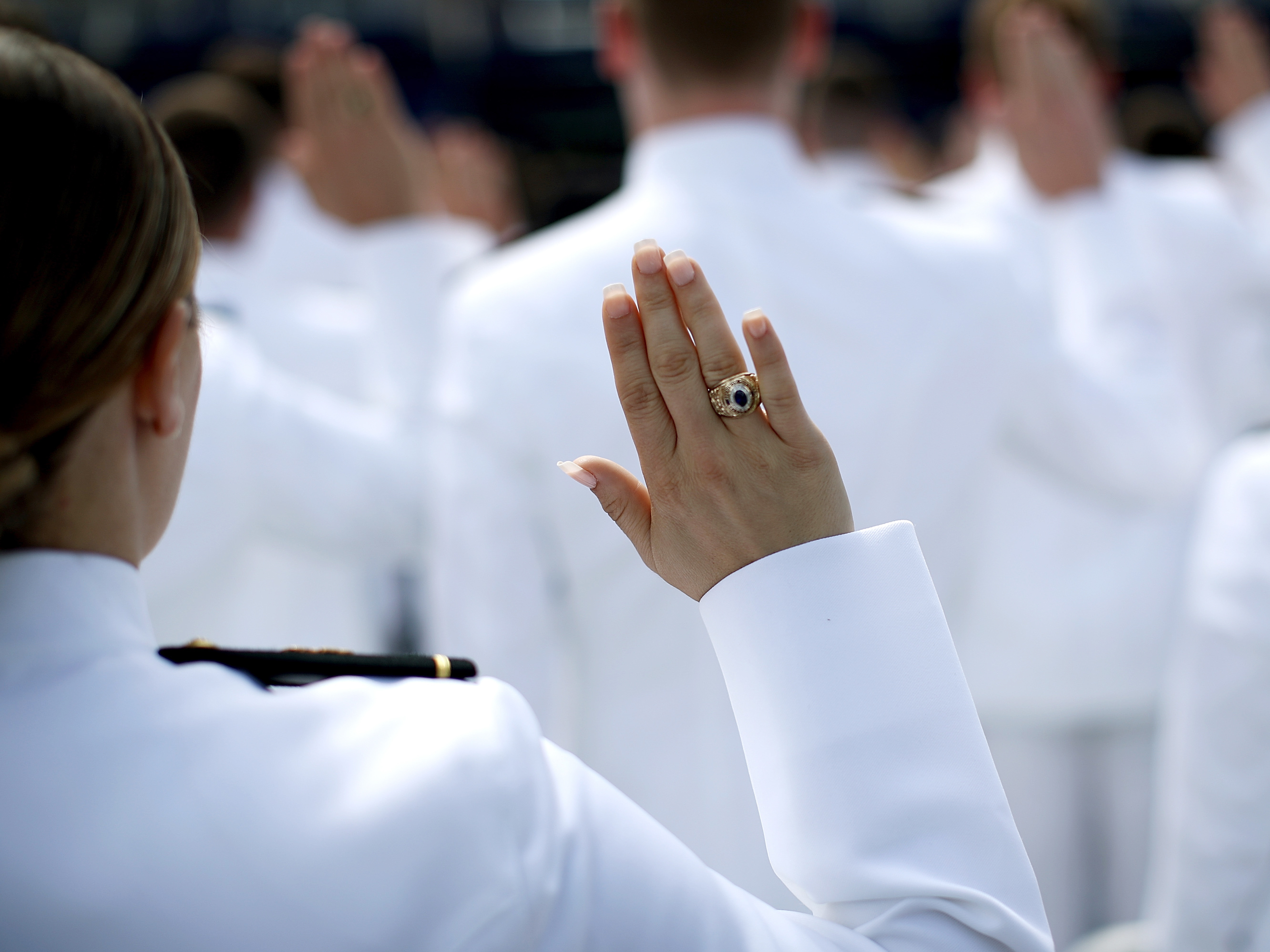 caption: 2017 graduation and commissioning ceremony at the U.S. Naval Academy. An anonymous Pentagon survey found that 747 students at the Navy, Army and Air Force academies experienced unwanted sexual contact during the past year, a nearly 50 percent increase from a similar survey taken two years earlier.