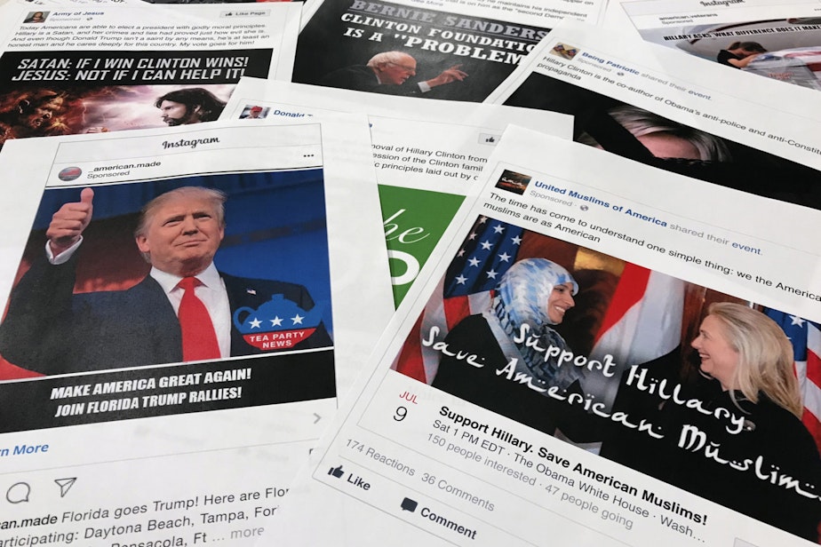 caption: Some of the Facebook and Instagram ads linked to a Russian effort to disrupt the American political process and stir up tensions around divisive social issues, released by members of the U.S. House Intelligence committee, are photographed in Washington. (AP Photo/Jon Elswick, File)