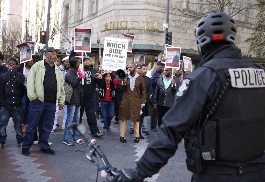 caption: A march protesting the Seattle police shooting of Che Taylor on Feb. 21 moves through downtown Seattle on Feb. 25, 2016.