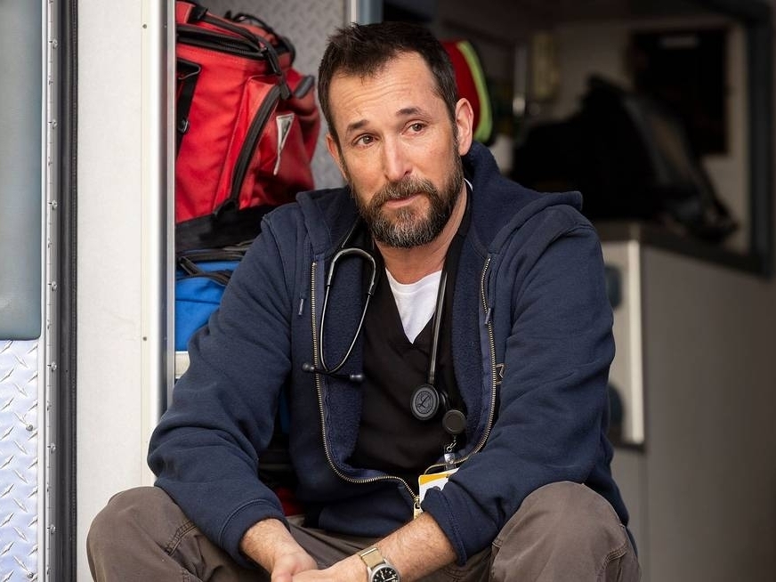 caption: Noah Wyle plays a senior attending physician working through PTSD in a Pittsburgh teaching hospital in the Max series <em>The Pitt.</em>