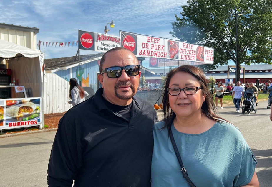 caption: Lupe Lee (right) with her husband Eric said she leans Democratic but will be voting Republican in Washington's 4th Congressional District race this year. 