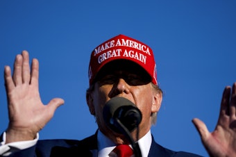 caption: Former President Donald Trump speaks during a rally on May 1, 2024 at Avflight Saginaw in Freeland, Mich.