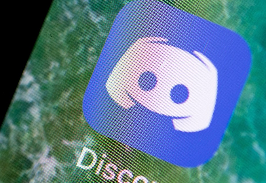 caption: Group-chat app Discord announced on Monday that in the second half of 2020, it took down more than 2,000 communities dedicated to extremist causes, of which more than 300 focused on the baseless conspiracy theory QAnon.
