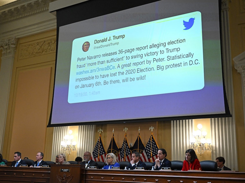 caption: A tweet by former President Donald Trump appears on screen during a House Select Committee hearing to investigate the Jan. 6 attack on the U.S. Capitol. Court documents reveal this tweet drew rioters to Washington, D.C., that day.