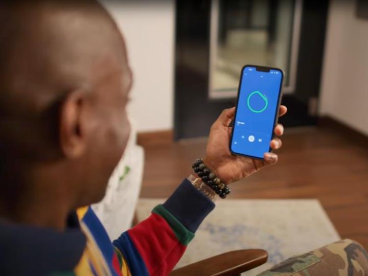 caption: Spotify AI DJ plays songs based on data it gathers about users' personal preferences and introduces some of them with a warm voice, similar to a traditional radio DJ.