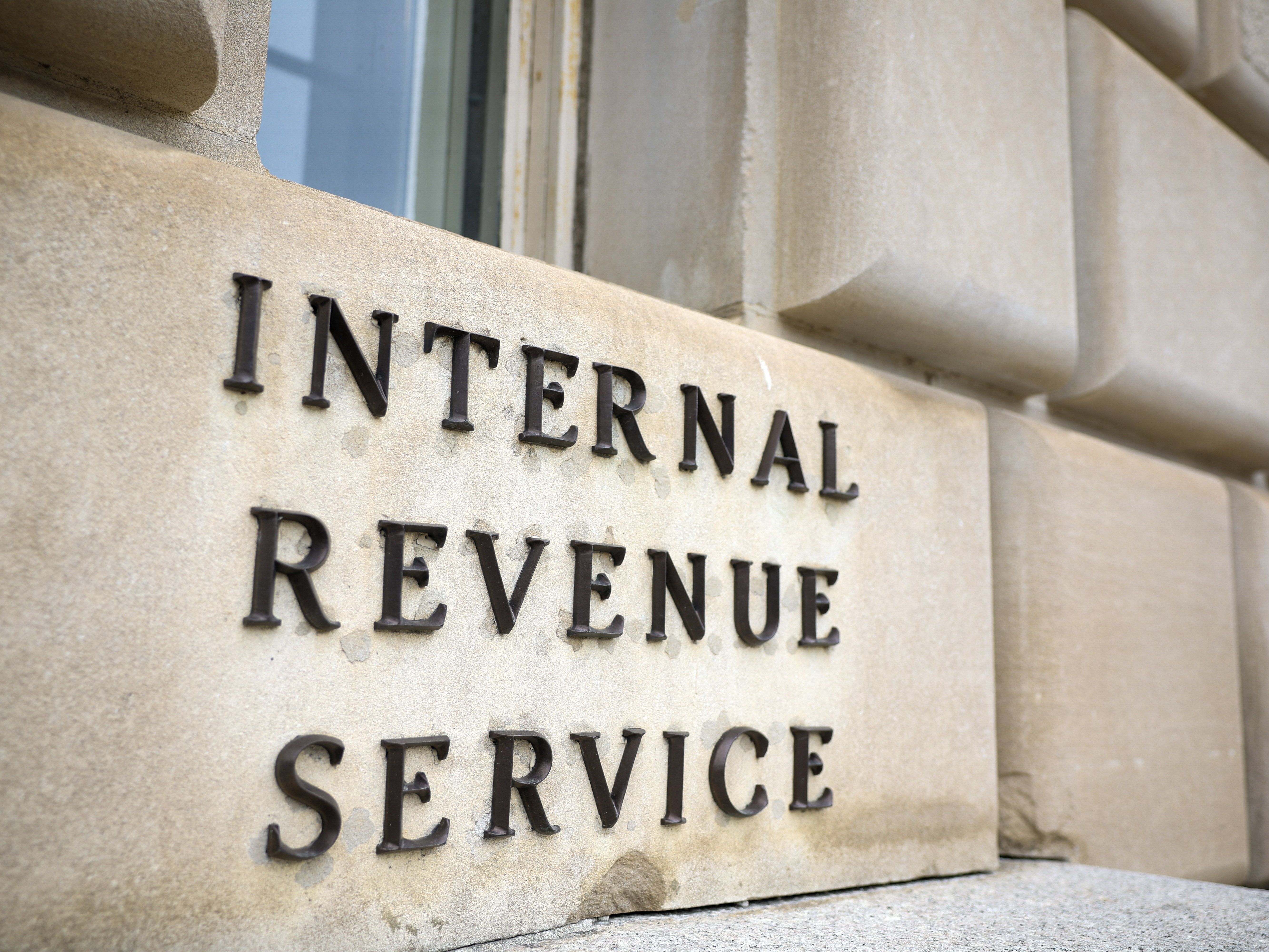 caption: President Trump has threatened to strip Harvard University and other non-profits of their tax-exempt status. It's one of several ways in which the president has tried to influence the tax collection agency.