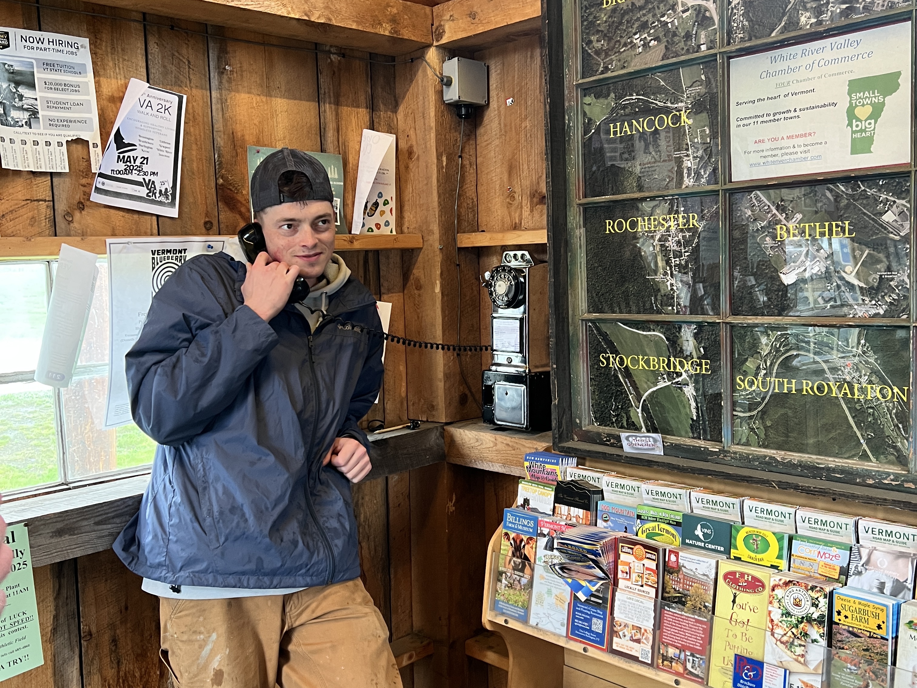 caption: Vermont Representative Philip Jay Hooper, who represents Orange County, makes a call using one of Patrick Schlott's payphones.
