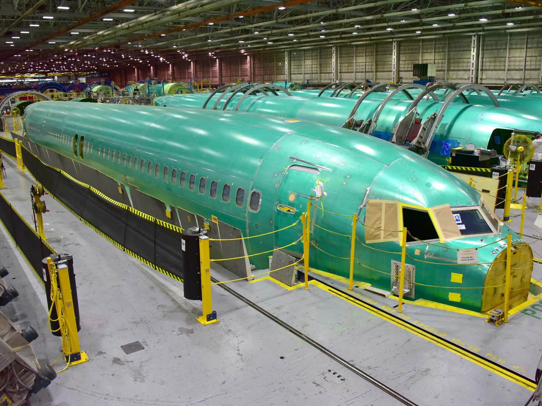 caption: Unfinished fuselages for the Boeing 737 during production at the Spirit AeroSystems factory in Wichita, Kan.