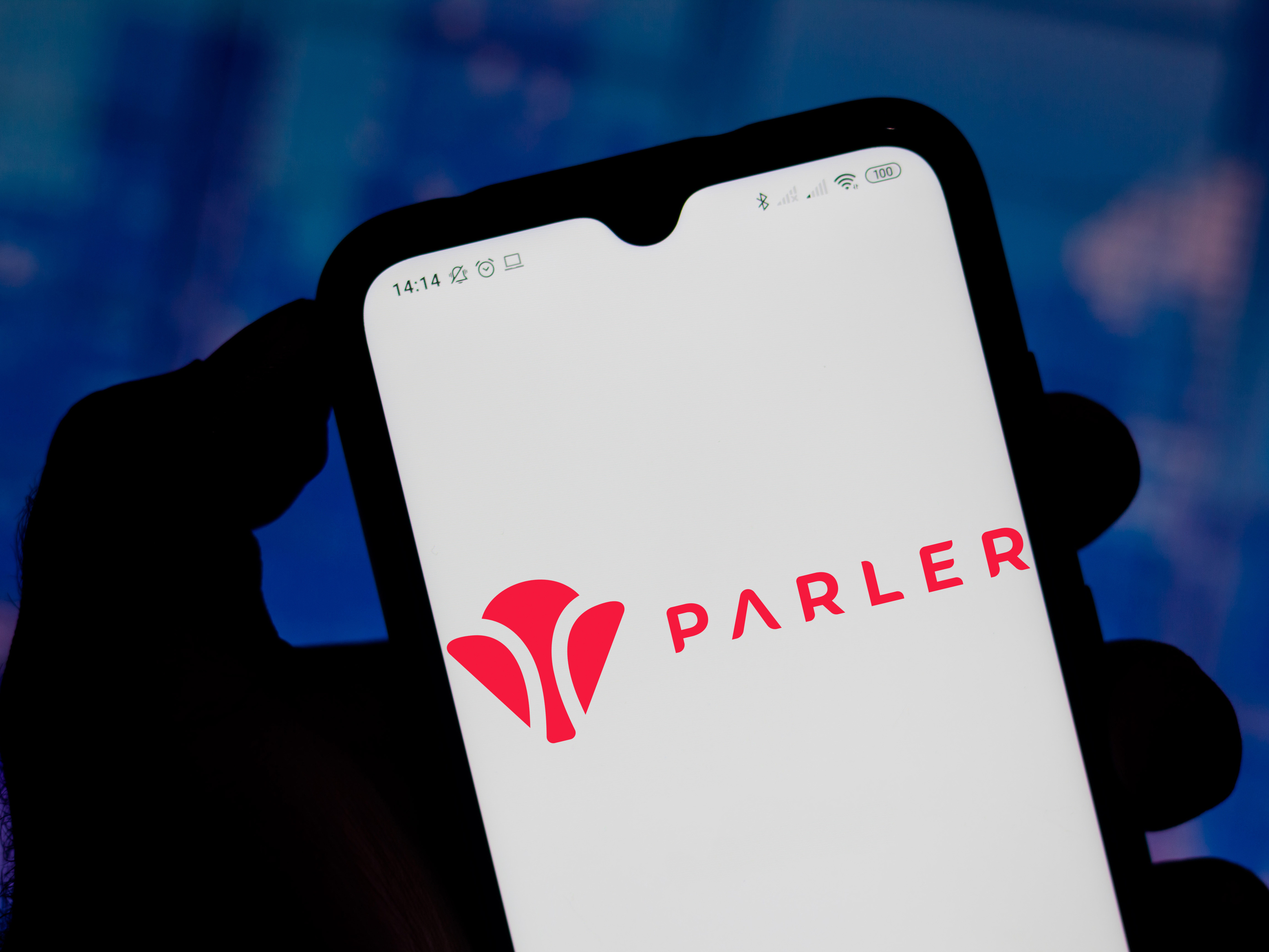 caption: Apple's app store is poised to reinstate Parler, which it suspended after the Capitol riots over what it described as violations of its guidelines around violent content.