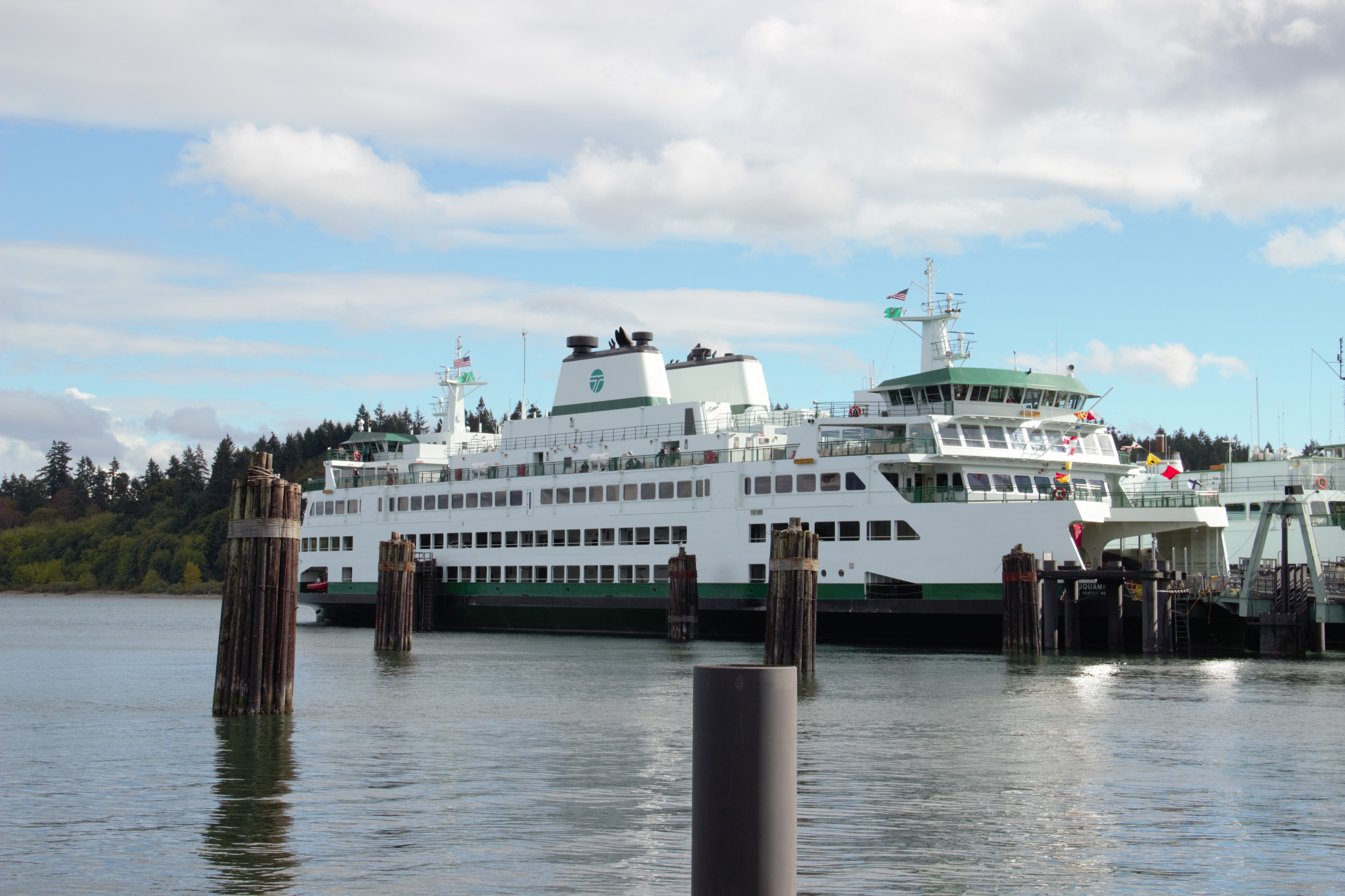 caption: Two new proposed hybrid-electric state ferries will be the same size as the newest ferry in the WSF fleet, the 144-car Suquamish.