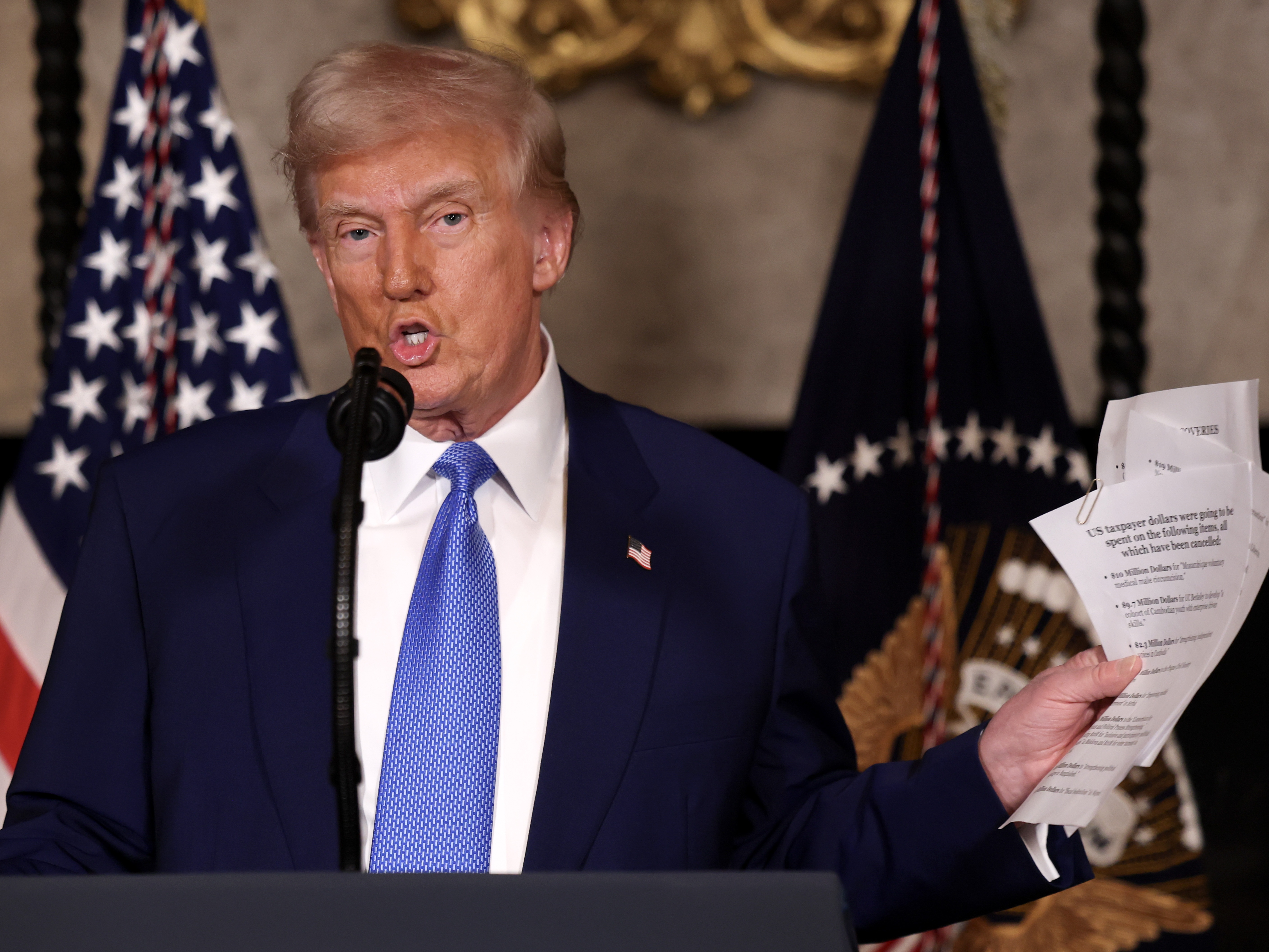 caption: President Trump speaks during a press conference Tuesday at his Mar-a-Lago resort in Palm Beach, Fla.