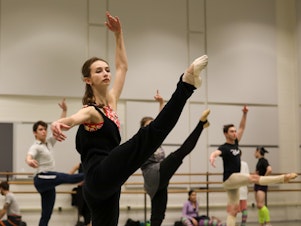 caption: Iryna Zhalovska and other dancers with The United Ukrainian Ballet train at The Kennedy Center. The company is performing <em>Giselle</em> there this week.