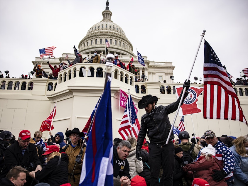 caption: A crowd of pro-Trump supporters storm the U.S. Capitol on Jan. 6, 2021. Senate Majority Leader Chuck Schumer is warning against the release of security footage from during the Capitol attack to Fox News host Tucker Carlson.