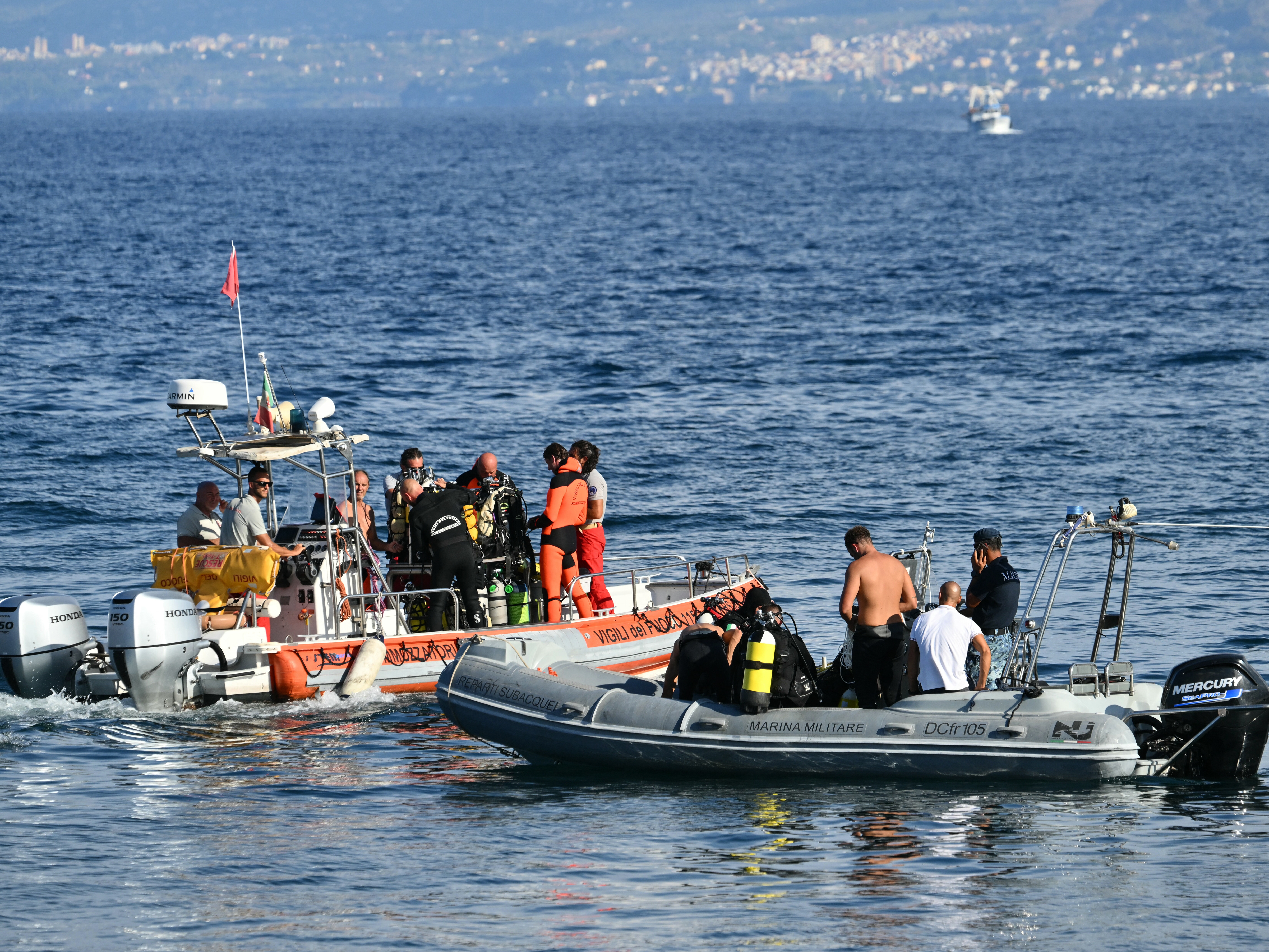 caption: Dive and recovery teams searched for a final missing person off Porticello harbor near Palermo on Aug. 22, three days after the British-flagged luxury yacht Bayesian sank.