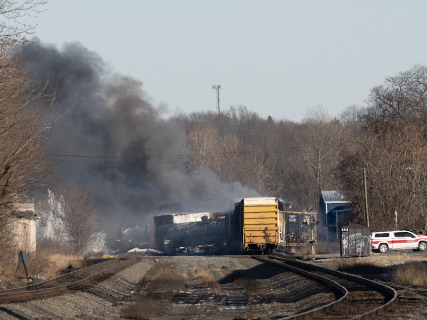 caption: Smoke rises from a derailed cargo train in East Palestine, Ohio, on February 4, 2023.