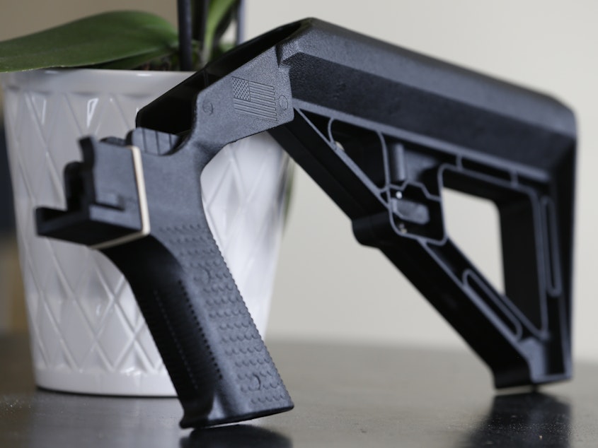 caption: A bump stock is displayed on March 15, 2019, in Harrisonburg, Va. A Trump administration ban on bump stocks, devices that enable a shooter to rapidly fire multiple rounds from semi-automatic weapons after an initial trigger pull, was struck down Friday by a federal appeals court in New Orleans.