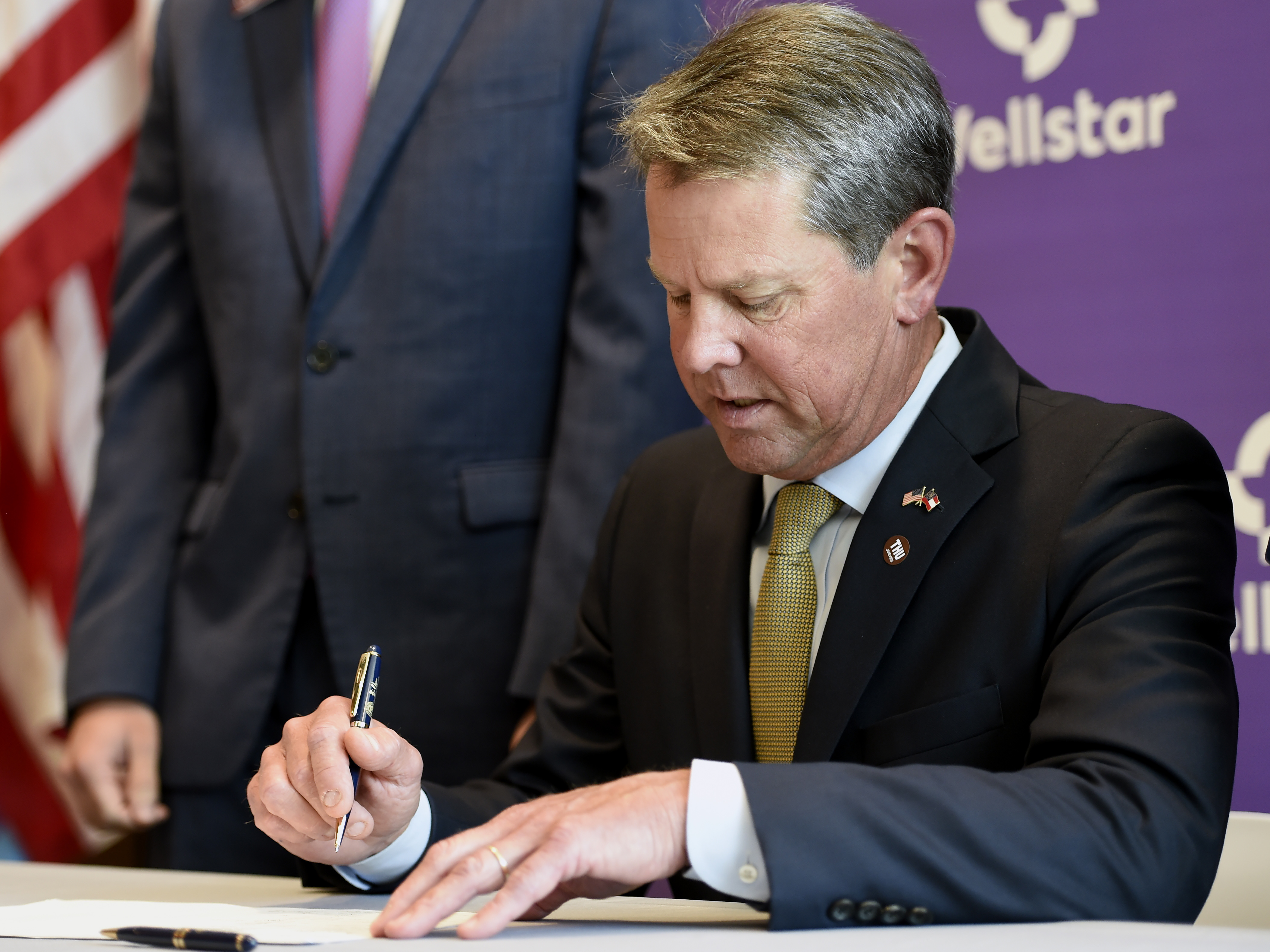 caption: Georgia Gov. Brian Kemp is taking Atlanta Mayor Keisha Lance Bottoms and the City Council to court to block the city's mask-wearing mandate.