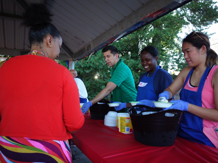 caption: As Shoreline's planning commission met Thursday night, people in the Ridgecrest neighborhood hold the biggest event on their calendar: their annual ice cream social. Shoreline mayor Chris Roberts, in green, is serving ice cream.