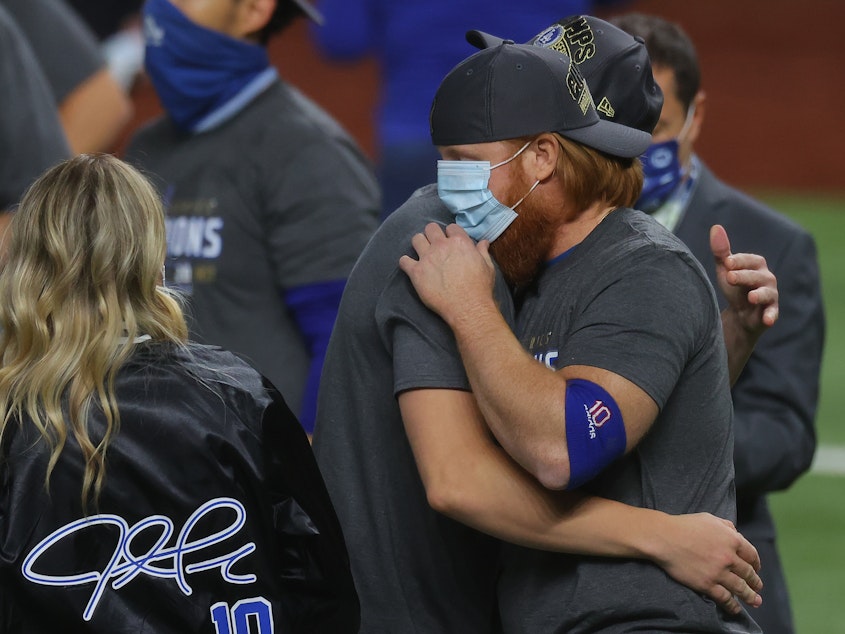 caption: Los Angeles Dodgers Third Baseman Justin Turner celebrates after defeating the Tampa Bay Rays 3-1 in Game Six to win the 2020 MLB World Series on Tuesday. Turner was removed from the game in the eighth inning after a positive coronavirus test.
