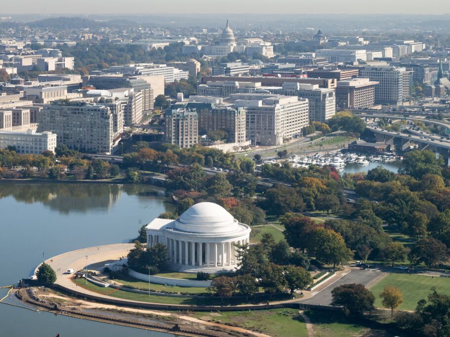 caption: The Jefferson Memorial and US Capitol are seen alongside the Tidal Basin in an aerial photograph taken on approach to Ronald Reagan Washington National Airport near Washington, DC, on October 22, 2024.