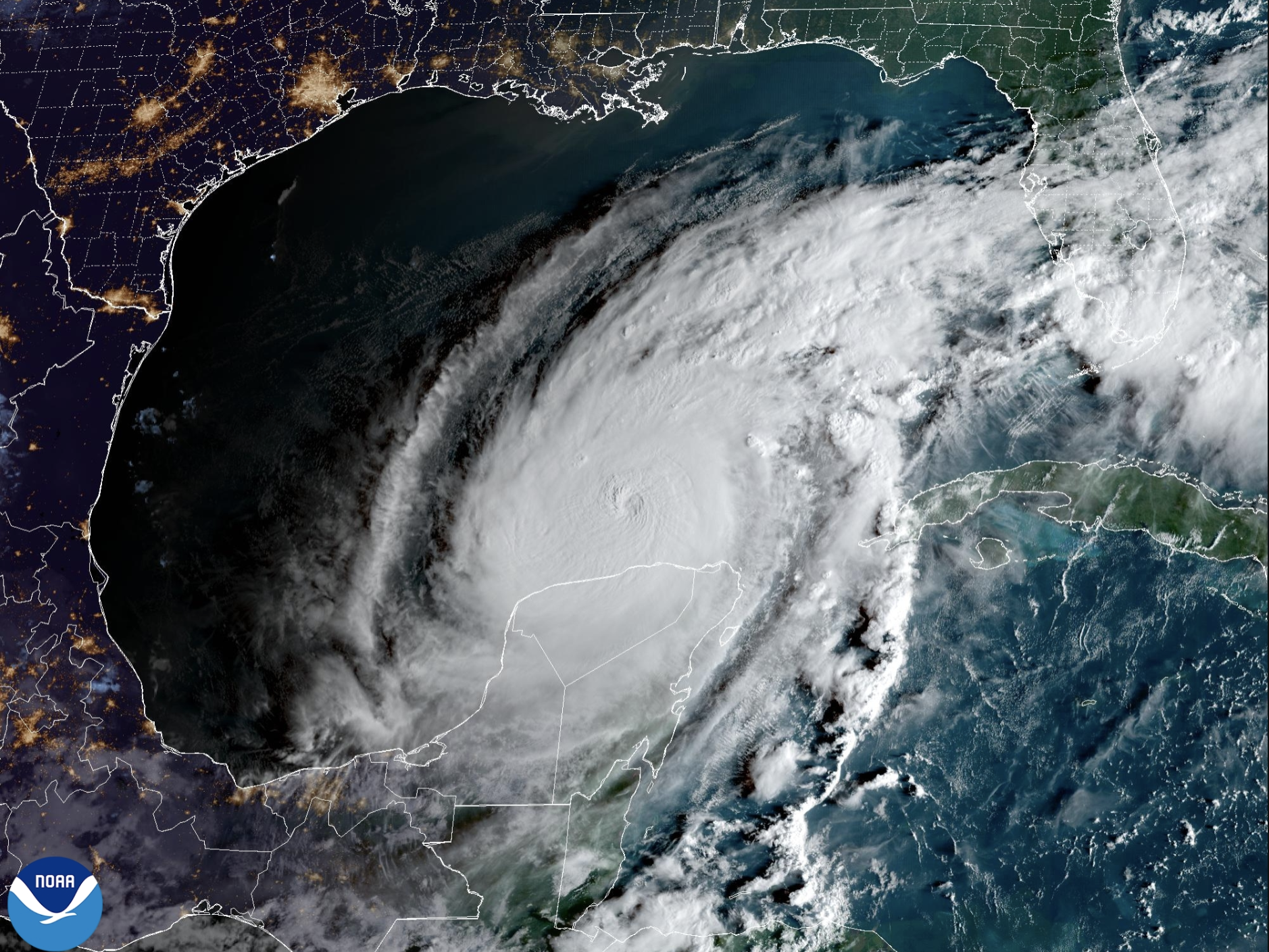 caption: A satellite image shows Hurricane Milton to the north of the Yucatan Peninsula as the sun rises over the Gulf of Mexico. The storm is forecast to start bringing dangerous conditions to Florida's western coast on Wednesday.
