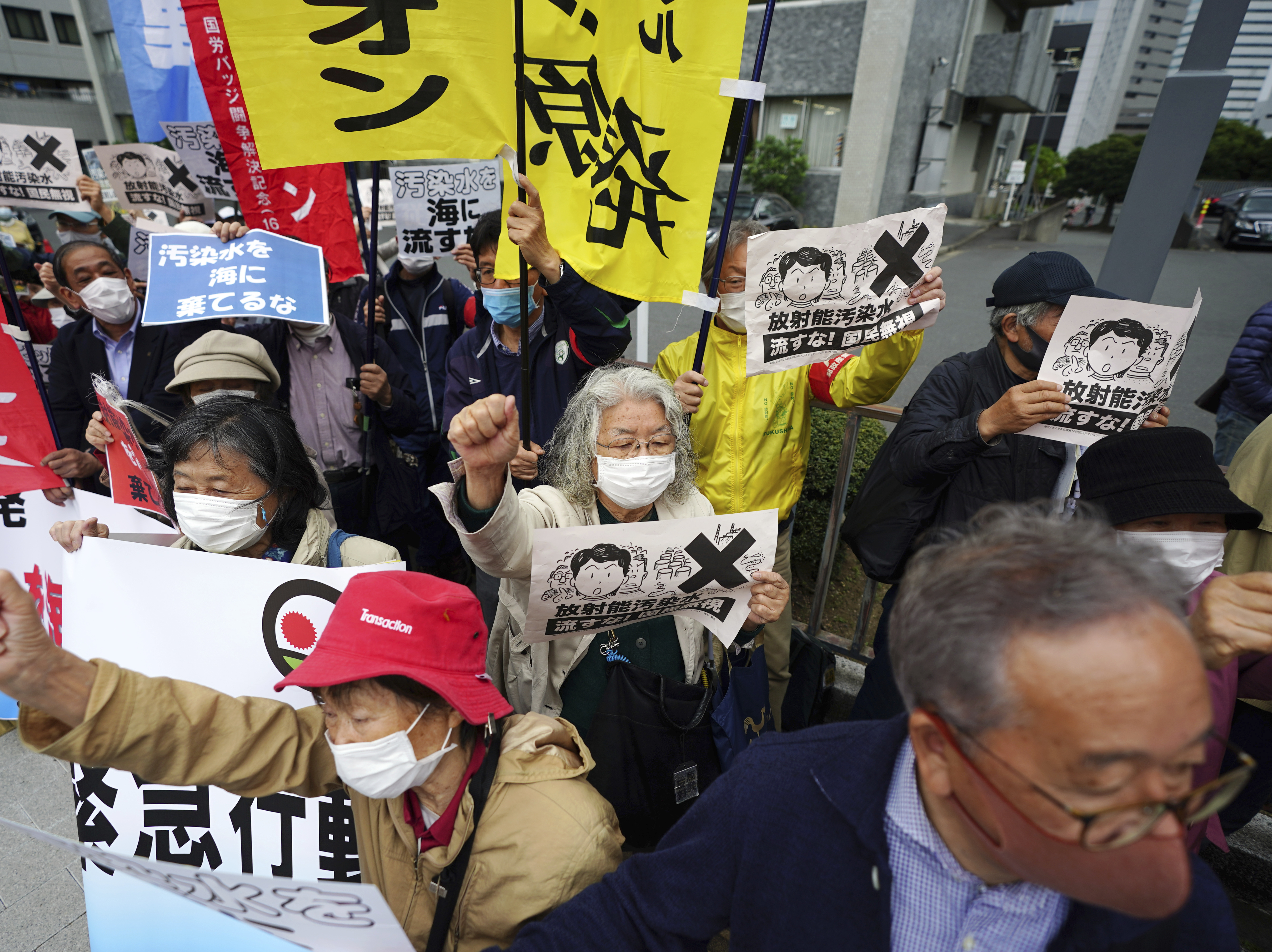 caption: People in Tokyo protest a decision to start releasing into the ocean massive amounts of treated wastewater from the Fukushima nuclear plant. The plant was damaged in a 2011 earthquake and tsunami.