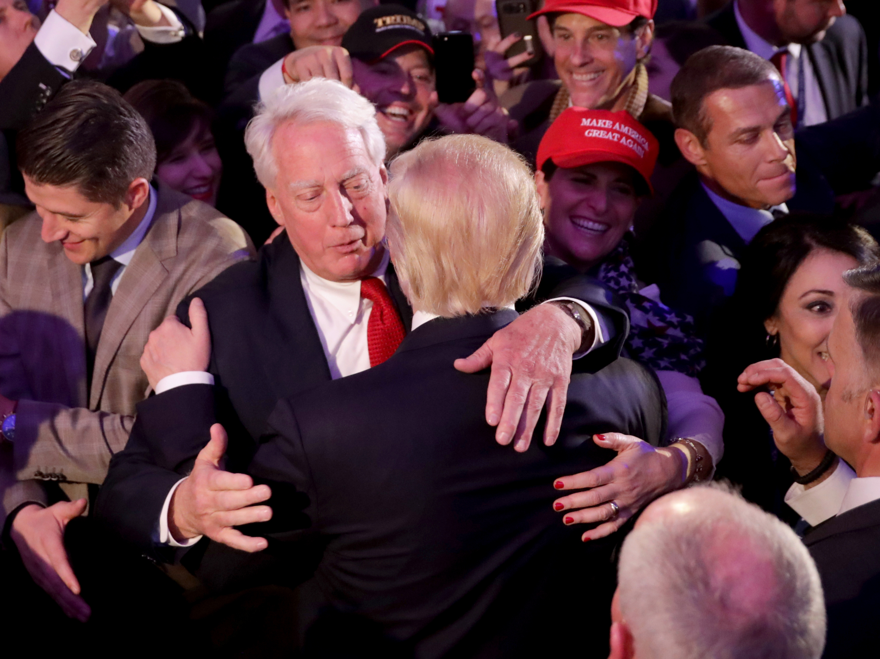 caption: Republican president-elect Donald Trump hugs his brother Robert Trump after delivering his acceptance speech at the New York Hilton Midtown in the early morning hours of Nov. 9, 2016, in New York City.