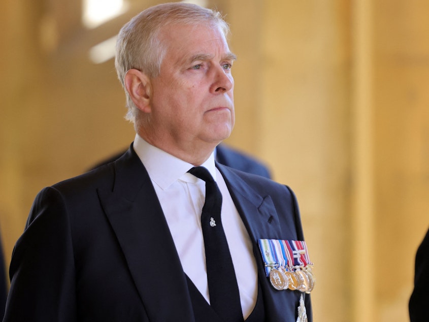 caption: Britain's Prince Andrew, Duke of York, attends the ceremonial funeral procession of Britain's Prince Philip, Duke of Edinburgh, to St George's Chapel in Windsor Castle on April 17, 2021.