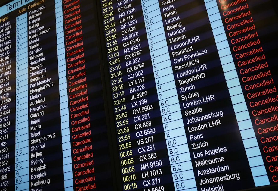 An information board shows canceled flights at Hong Kong's international airport.