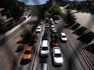 caption: Cars line up outside the Dennis DeConcini Port of Entry in Nogales, Sonora, Mexico.