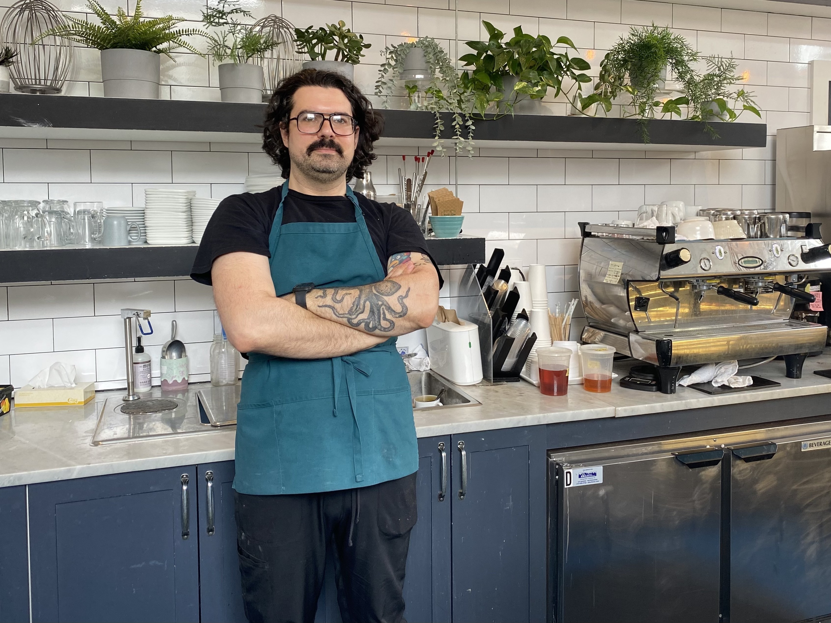caption: Dylan Schenker got his first barista job about a decade ago. He says, "At first it was just a job," but he then got passionate about it. But increasingly he's becoming dependent on tips and says people have a fundamental misunderstanding about tipping.