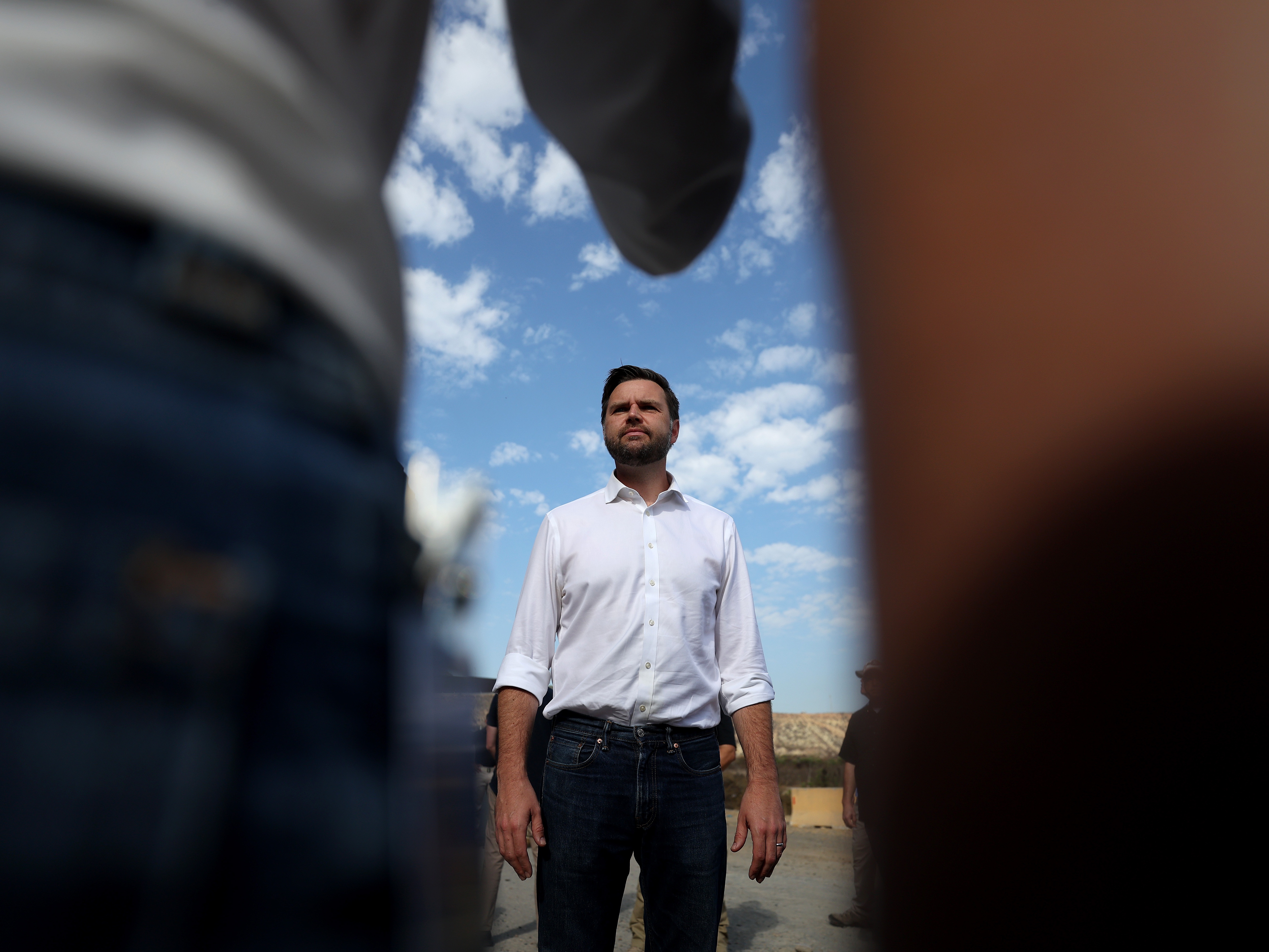 caption: Republican vice presidential nominee, U.S. Sen. JD Vance (R-Ohio) speaks to reporters in front of the border wall with Mexico on September 06, 2024 in San Diego, California. 