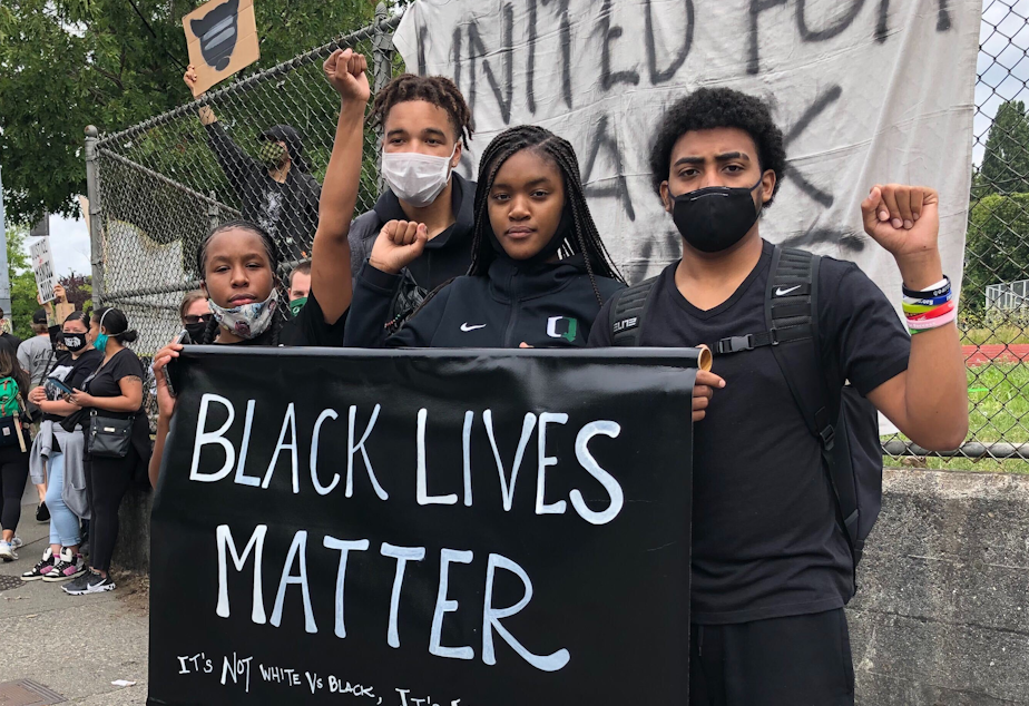 caption: Franklin High School students (L-R) Araeya Reed, Deon Hair, Jr., Mya Jones and Giovanni Olibrice protested police brutality on June 5th, 2020.